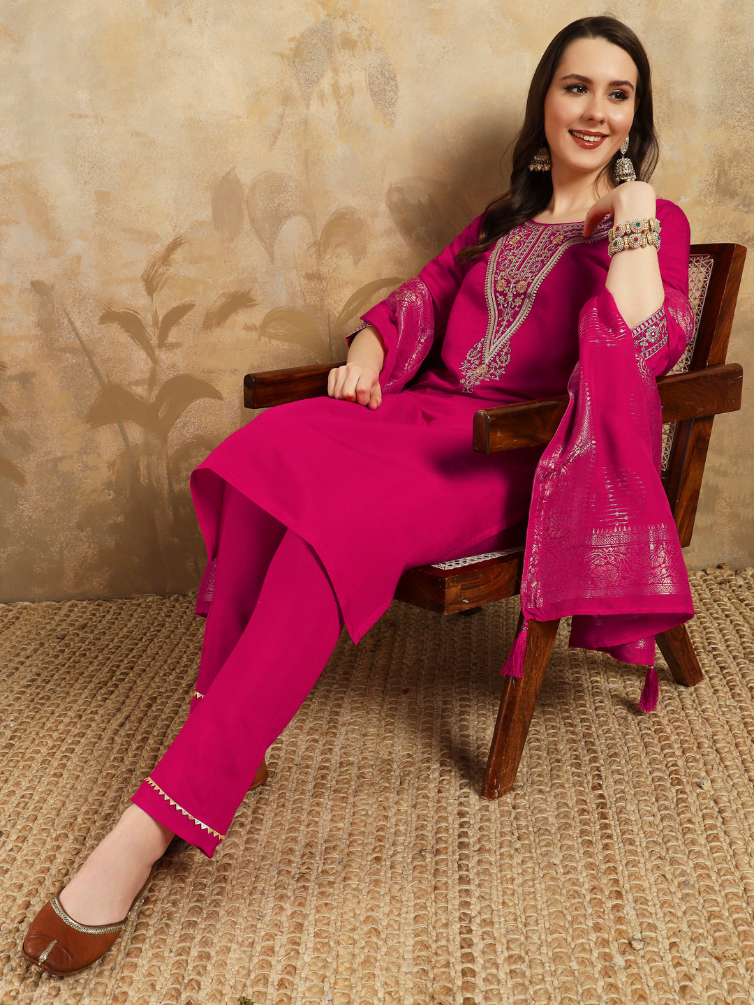 Radiate grace in this stunning magenta kurti set, adorned with intricate embroidery and delicate golden accents