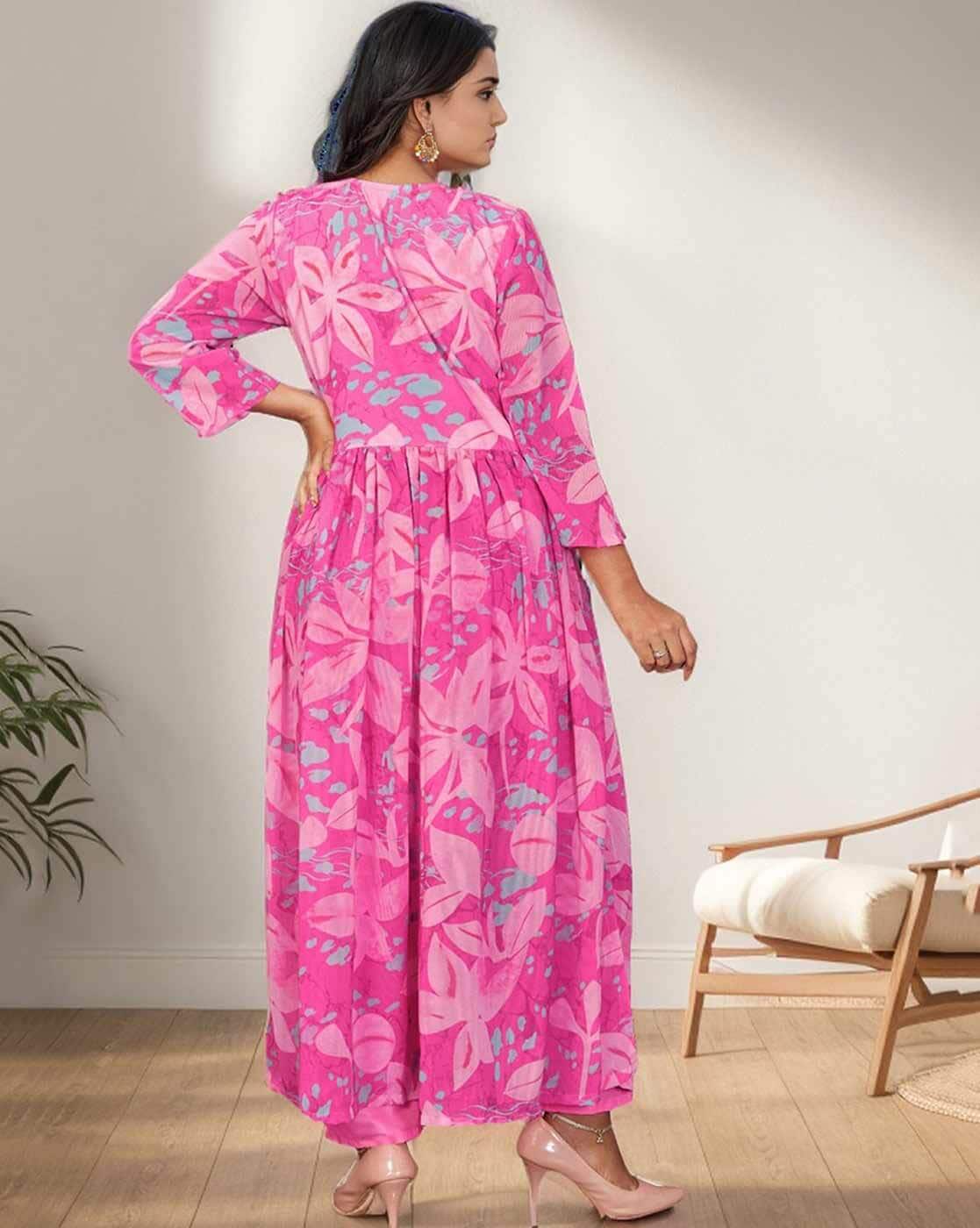 Step into elegance with this stunning pink floral kurti set, featuring delicate embroidery and a flowy silhouette