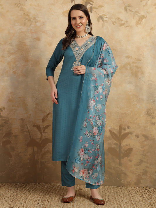 Infuse your wardrobe with elegance in this teal kurta set, showcasing delicate embroidery and a romantic floral dupatta