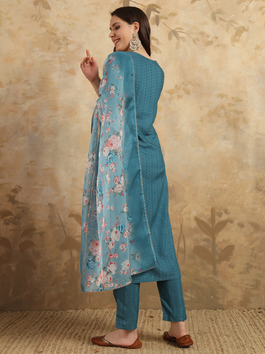 Infuse your wardrobe with elegance in this teal kurta set, showcasing delicate embroidery and a romantic floral dupatta