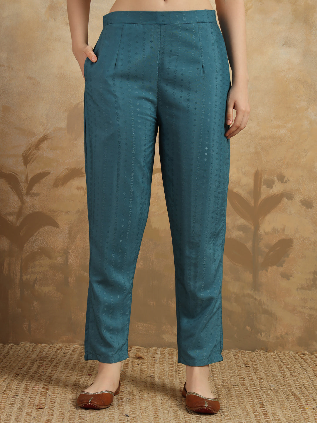 Infuse your wardrobe with elegance in this teal kurta set, showcasing delicate embroidery and a romantic floral dupatta