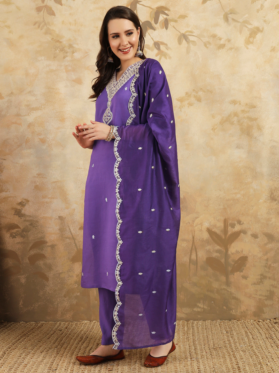 Elevate your style with this stunning purple kurta set, featuring intricate, white embroidery along the neckline and a matching dupatta