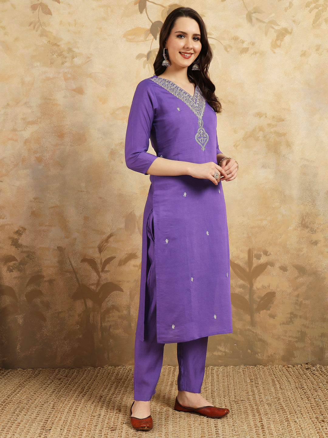 Elevate your style with this stunning purple kurta set, featuring intricate, white embroidery along the neckline and a matching dupatta