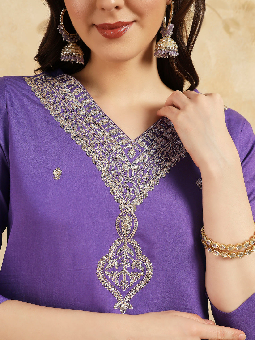 Elevate your style with this stunning purple kurta set, featuring intricate, white embroidery along the neckline and a matching dupatta