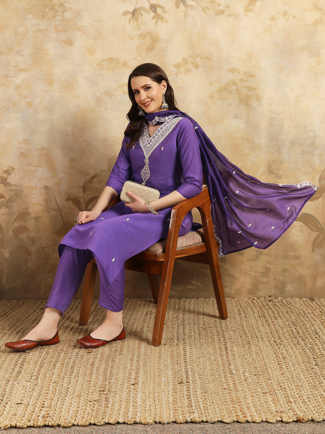Elevate your style with this stunning purple kurta set, featuring intricate, white embroidery along the neckline and a matching dupatta