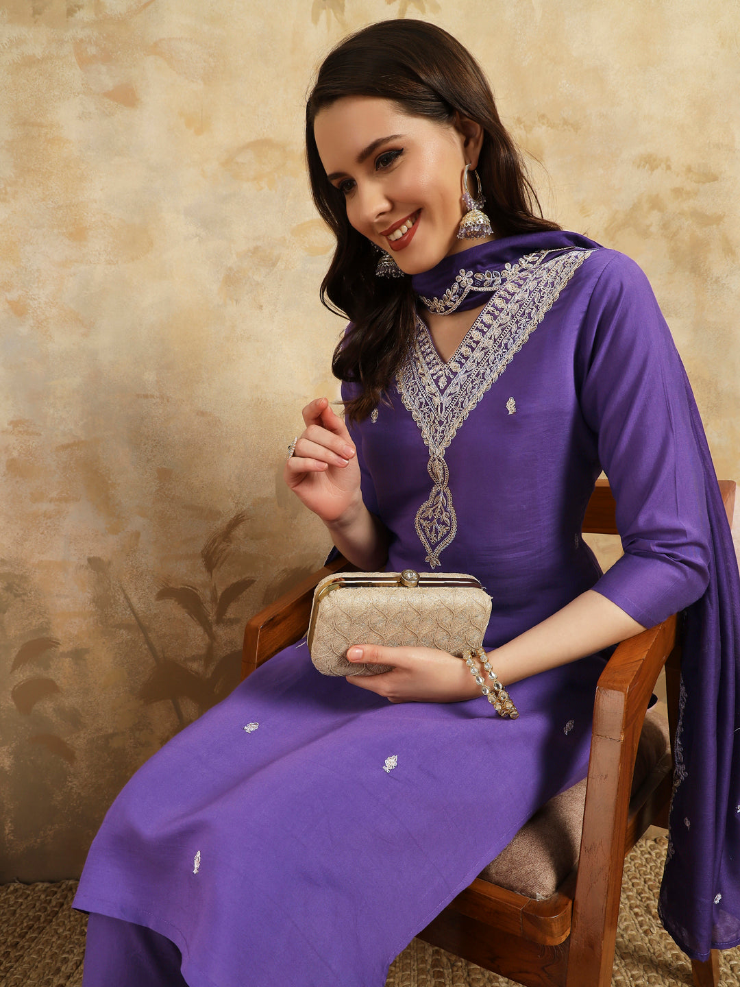 Elevate your style with this stunning purple kurta set, featuring intricate, white embroidery along the neckline and a matching dupatta