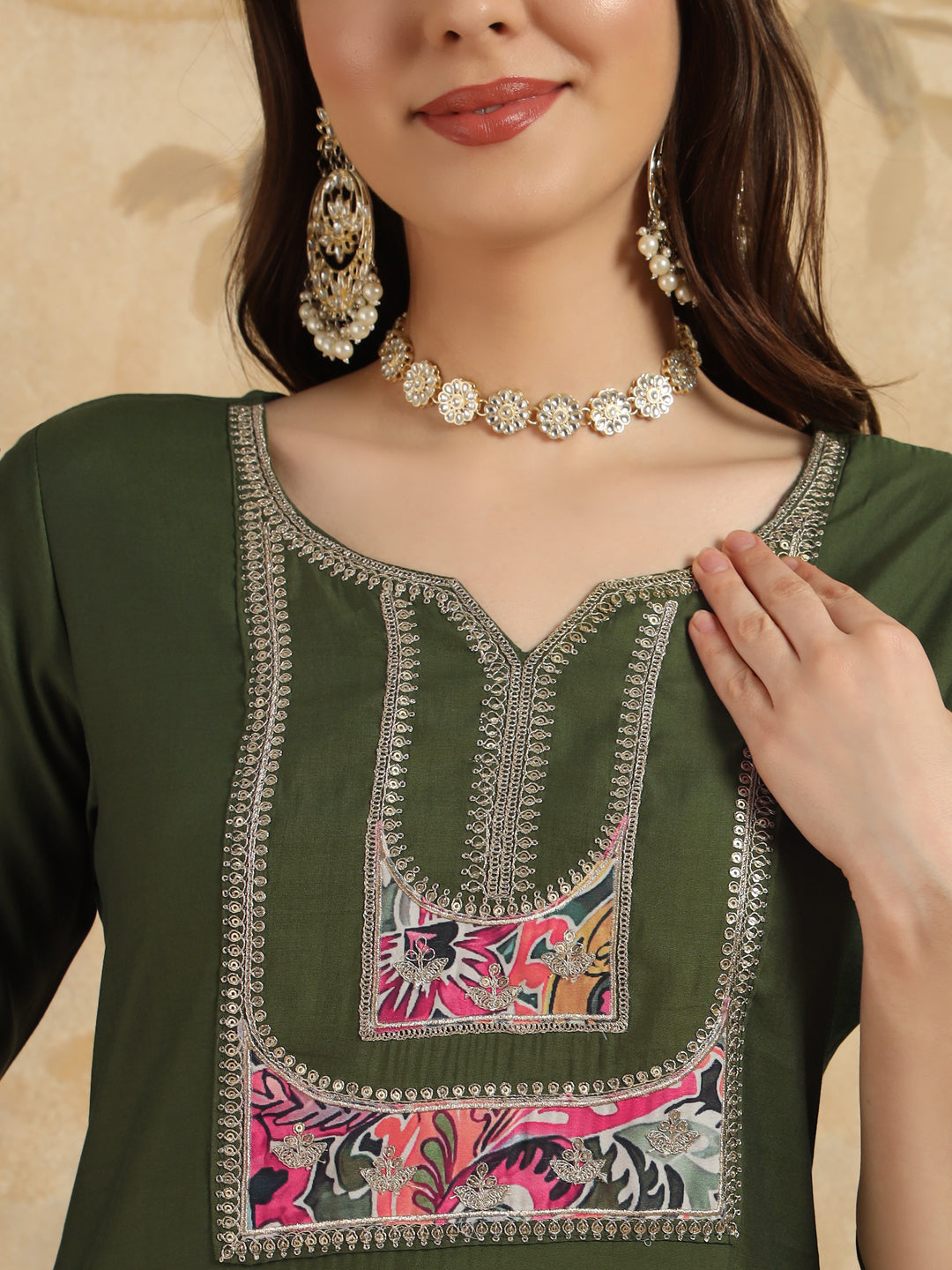 Elevate your style with this elegant olive green kurta set, featuring intricate embroidery and a vibrant paisley-print dupatta28)