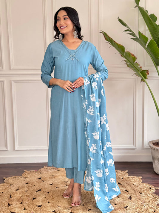Exude elegance in this serene blue kurta set, adorned with delicate embroidery and a charming floral-print dupatta