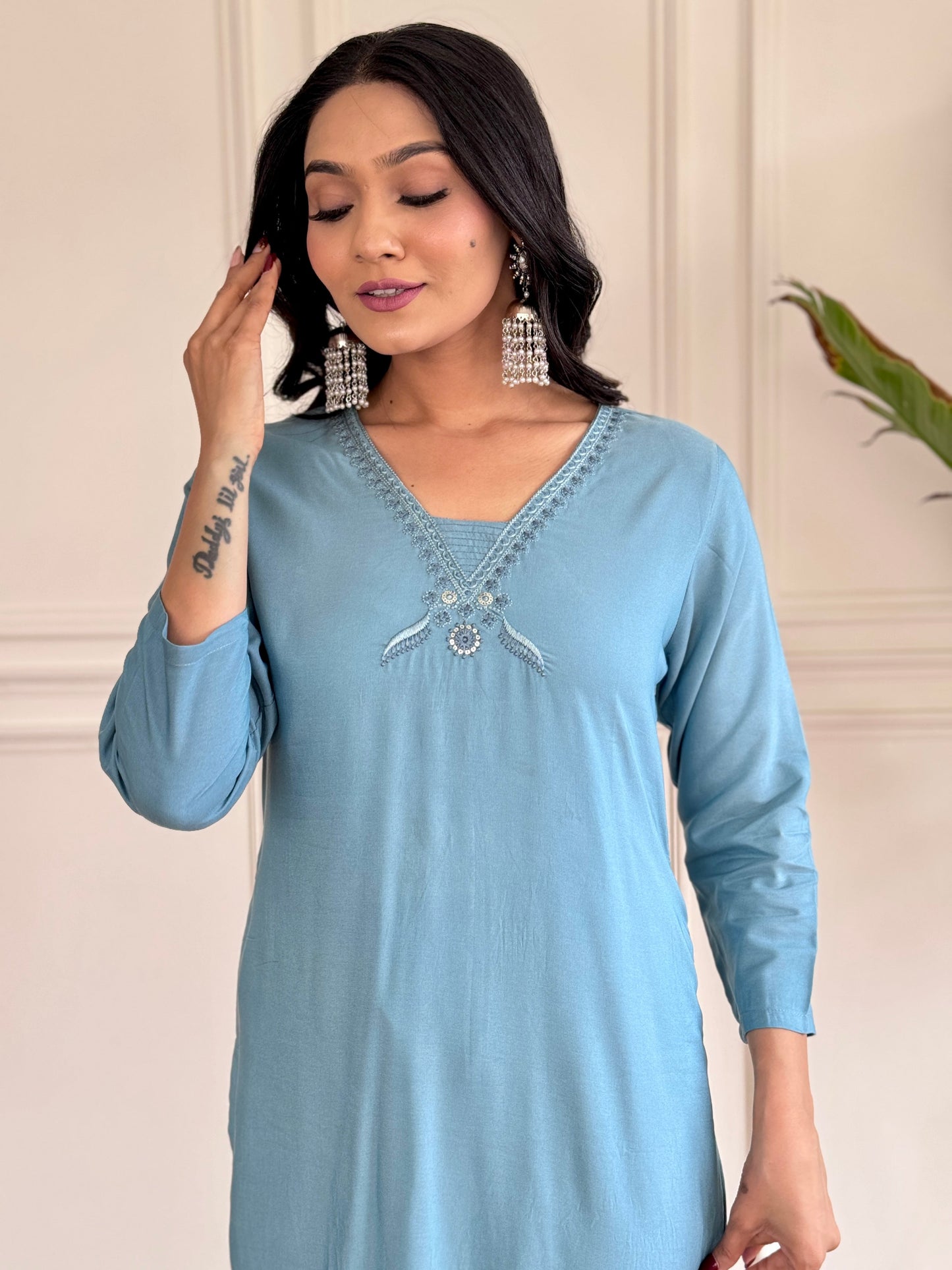 Exude elegance in this serene blue kurta set, adorned with delicate embroidery and a charming floral-print dupatta