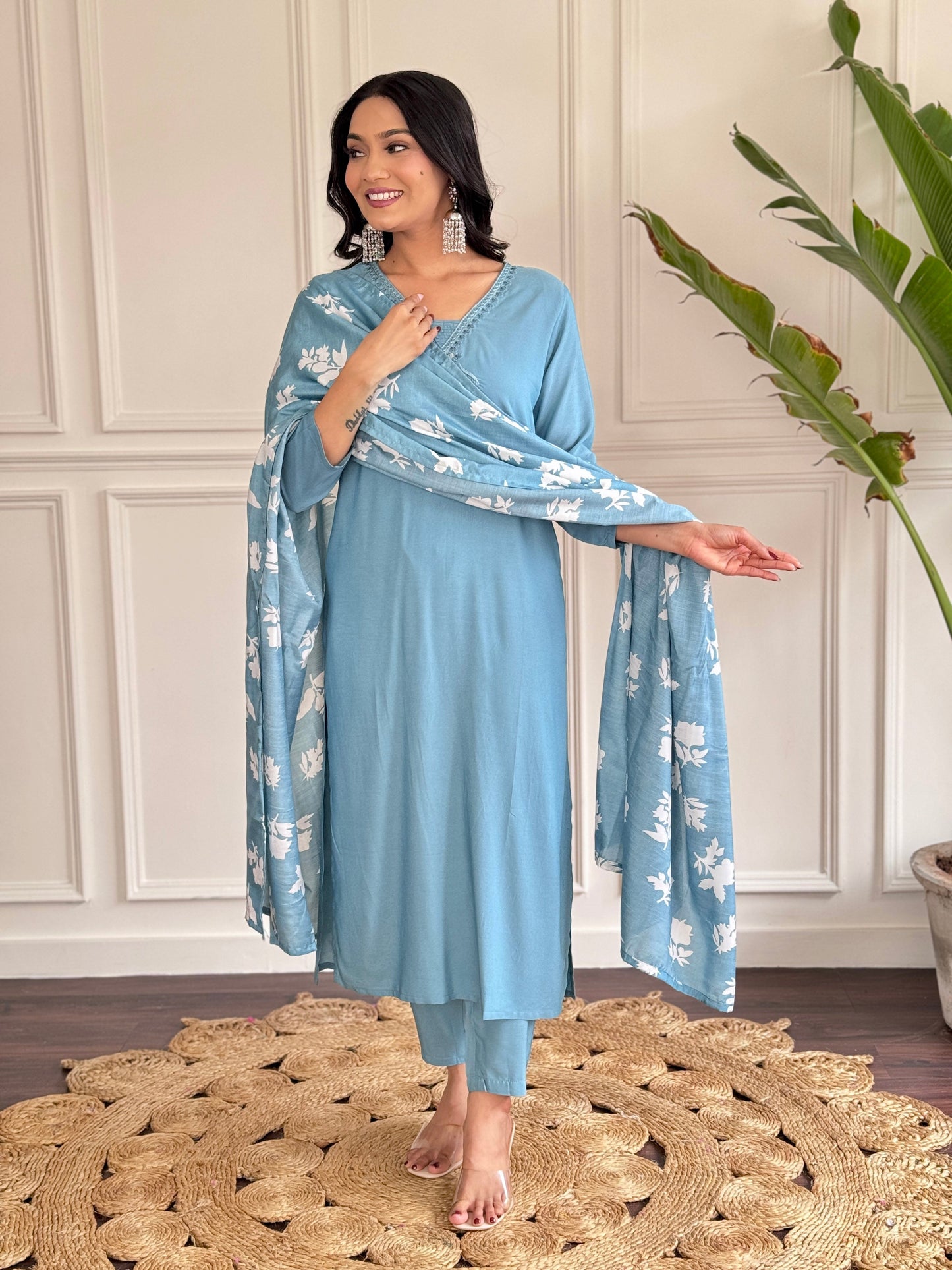 Exude elegance in this serene blue kurta set, adorned with delicate embroidery and a charming floral-print dupatta