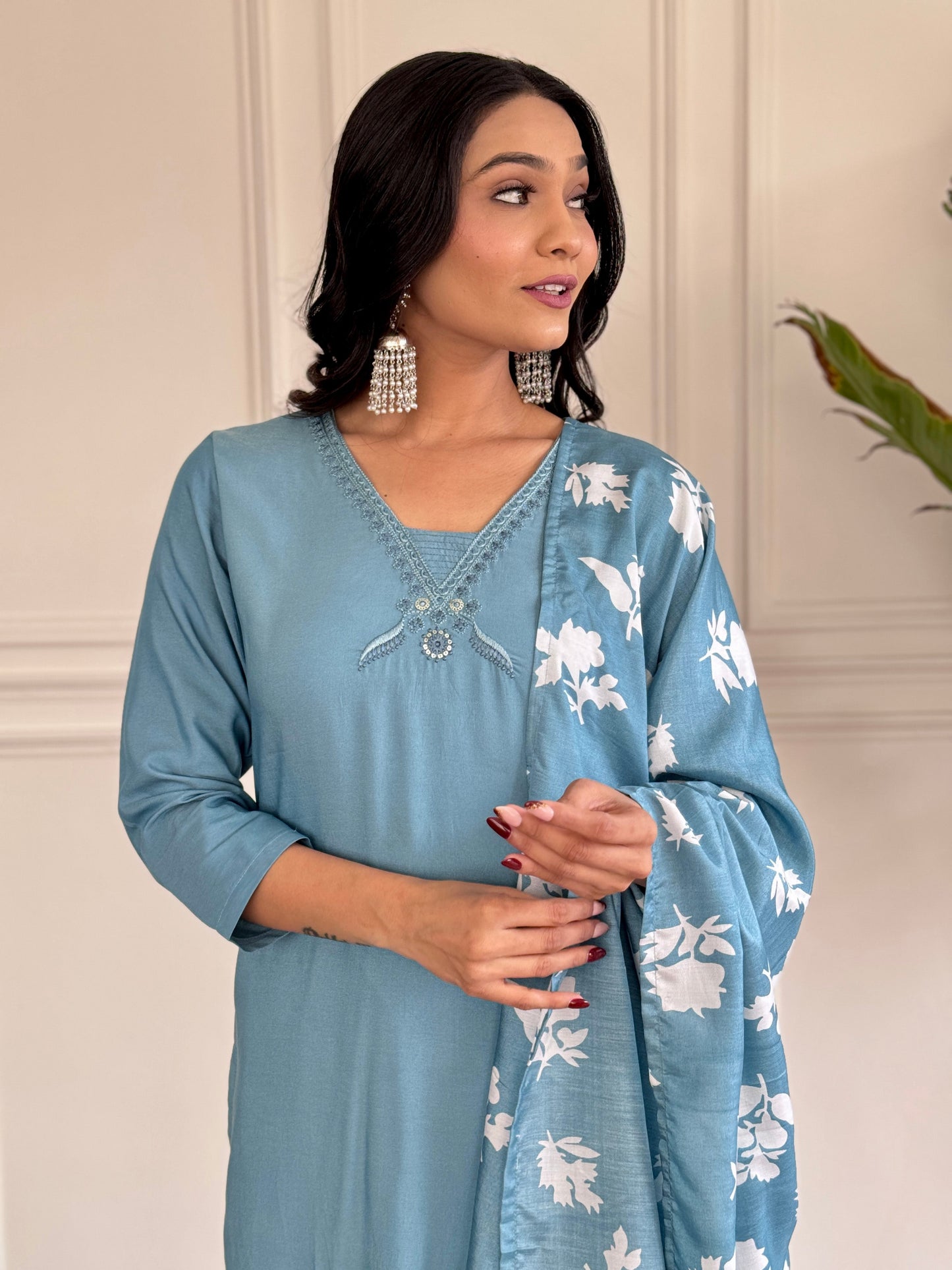 Exude elegance in this serene blue kurta set, adorned with delicate embroidery and a charming floral-print dupatta