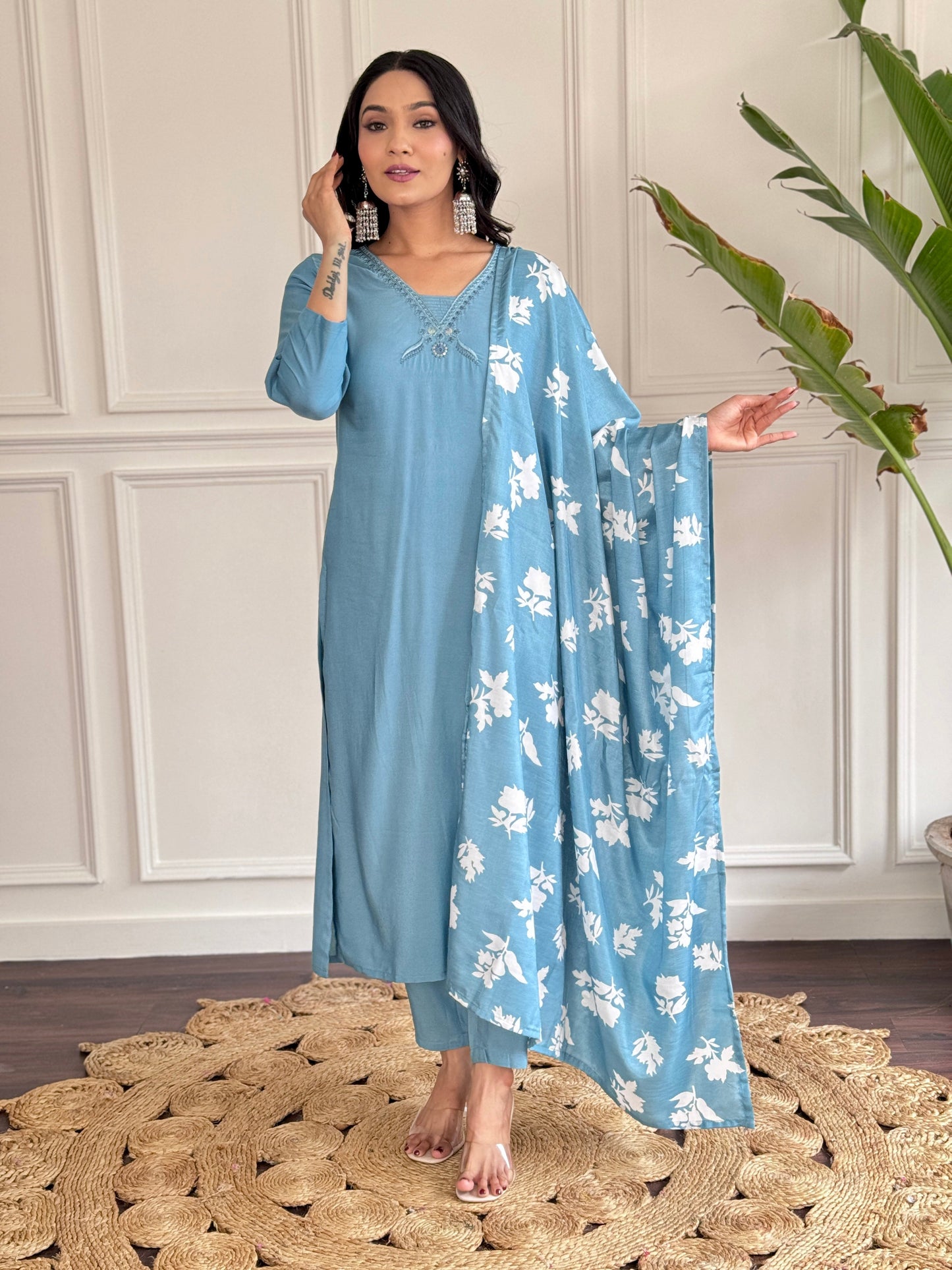 Exude elegance in this serene blue kurta set, adorned with delicate embroidery and a charming floral-print dupatta