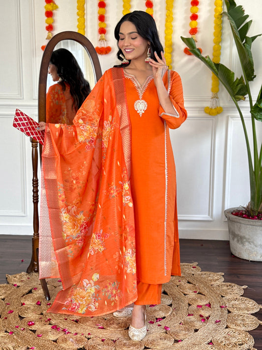 Radiate festive charm in this vibrant orange kurta set, adorned with delicate embroidery and a stunning floral dupatta