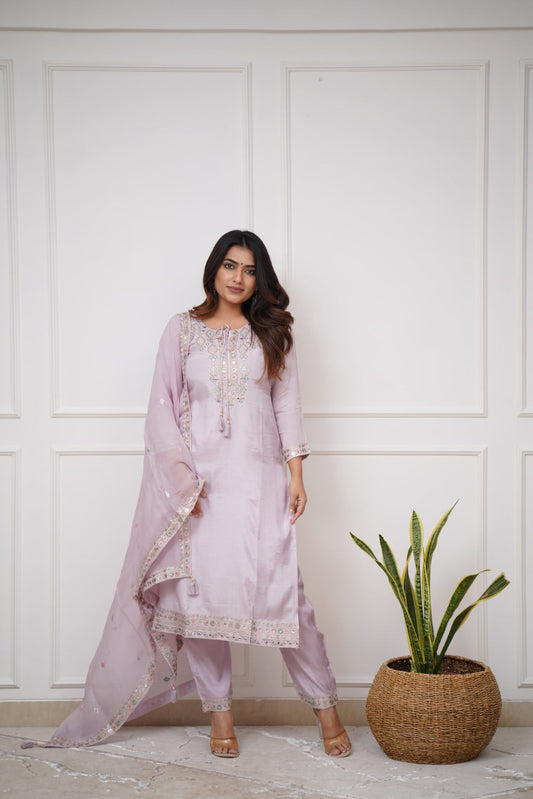 Grace meets elegance in this pastel lavender kurti set, adorned with delicate embroidery and mirror work