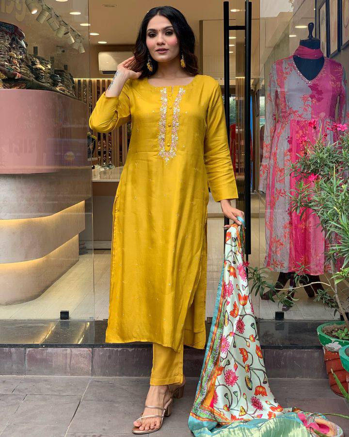 Brighten up your wardrobe with this mustard yellow kurti set, featuring delicate embroidery and a vibrant multicolored dupatta