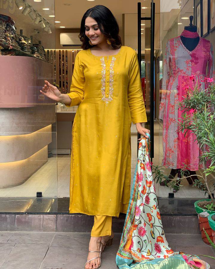 Brighten up your wardrobe with this mustard yellow kurti set, featuring delicate embroidery and a vibrant multicolored dupatta