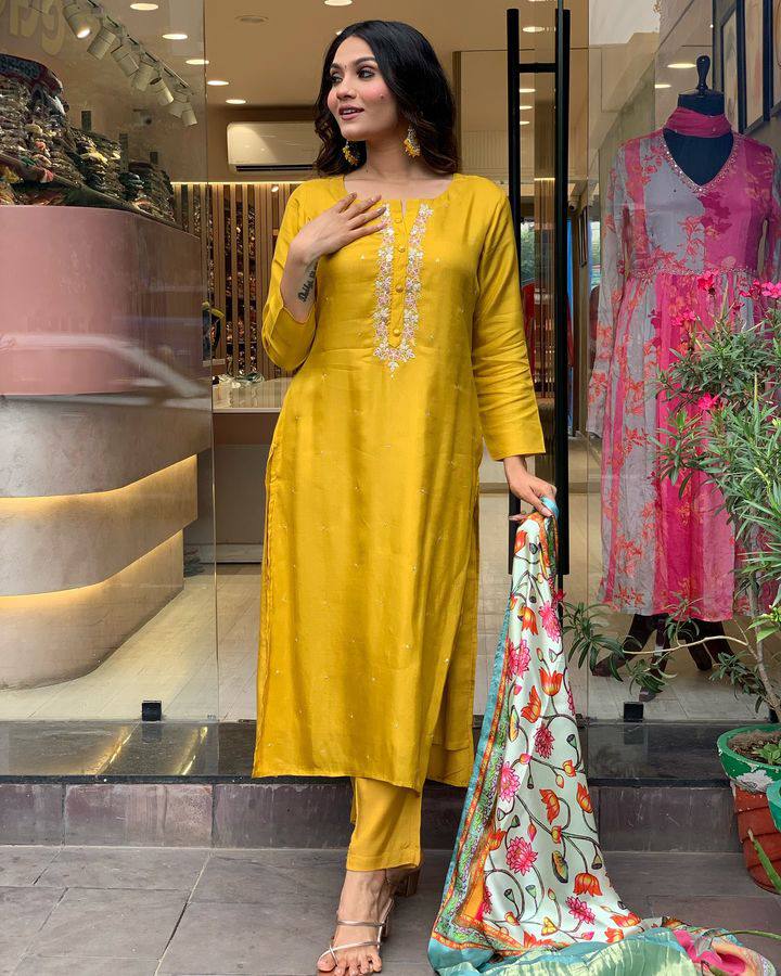 Brighten up your wardrobe with this mustard yellow kurti set, featuring delicate embroidery and a vibrant multicolored dupatta