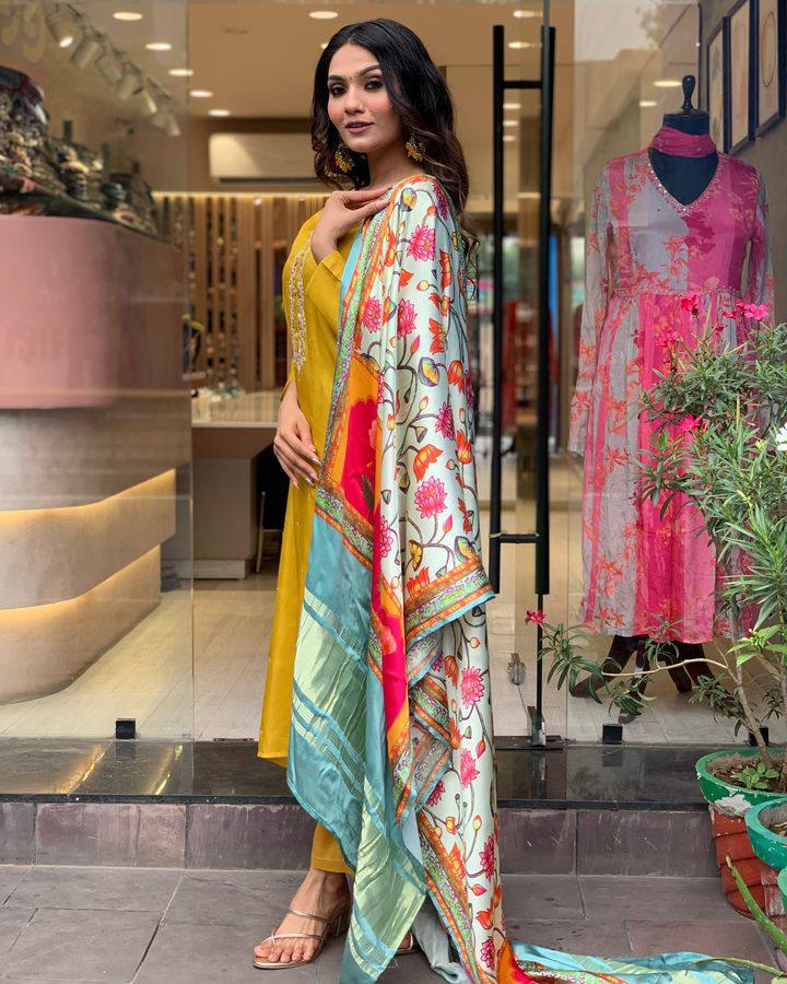 Brighten up your wardrobe with this mustard yellow kurti set, featuring delicate embroidery and a vibrant multicolored dupatta