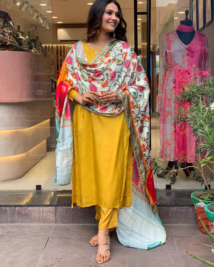 Brighten up your wardrobe with this mustard yellow kurti set, featuring delicate embroidery and a vibrant multicolored dupatta