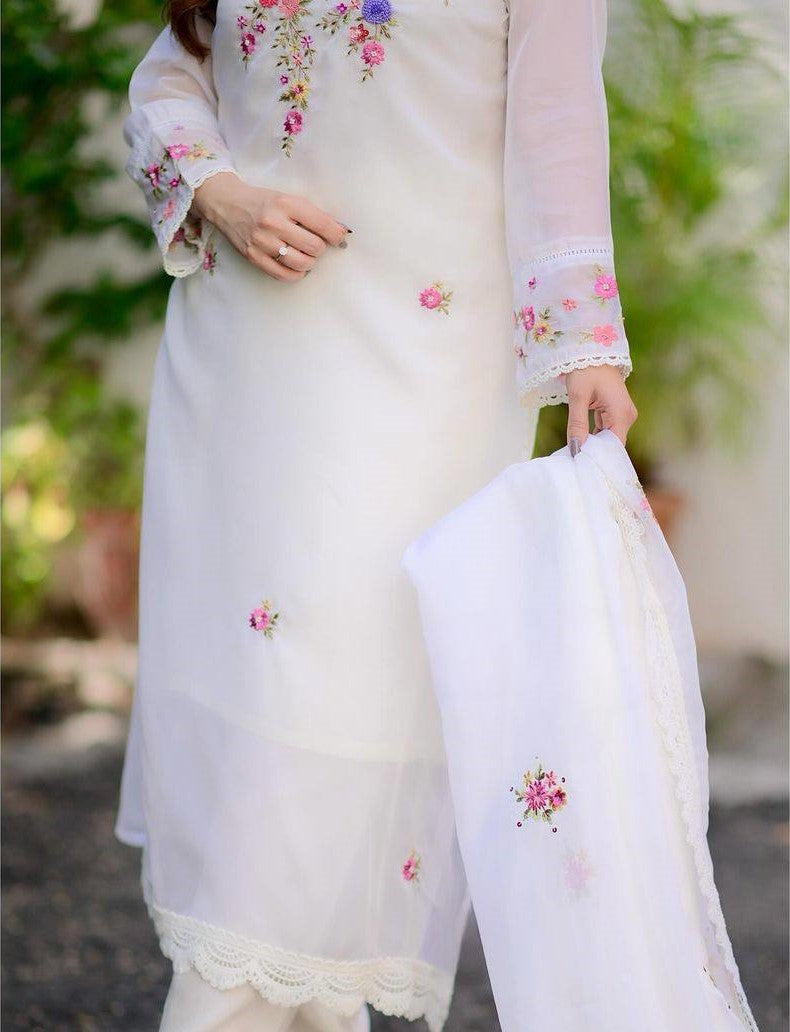 Radiate grace in this white floral embroidered kurti set, featuring delicate pastel blooms and a soft, flowy silhouette
