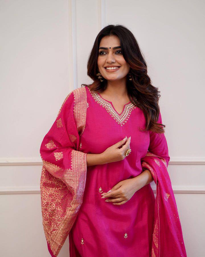 Embrace elegance in this exquisite pink kurti set, featuring intricate embroidery, a luxurious dupatta with gold detailing, and a timeless silhouette