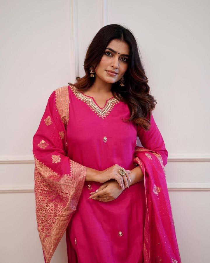 Embrace elegance in this exquisite pink kurti set, featuring intricate embroidery, a luxurious dupatta with gold detailing, and a timeless silhouette