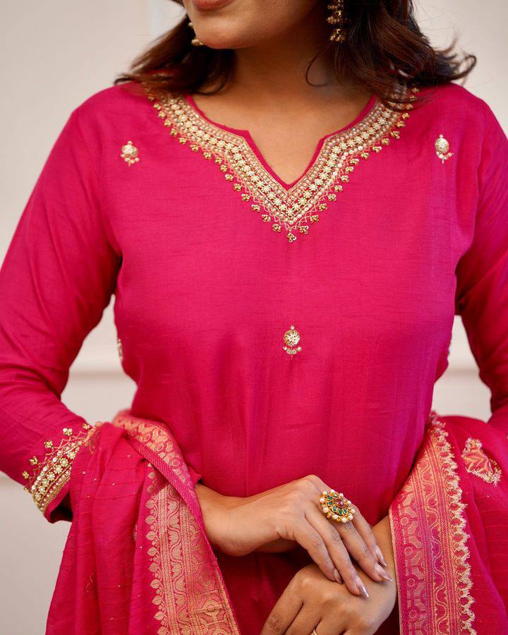 Embrace elegance in this exquisite pink kurti set, featuring intricate embroidery, a luxurious dupatta with gold detailing, and a timeless silhouette