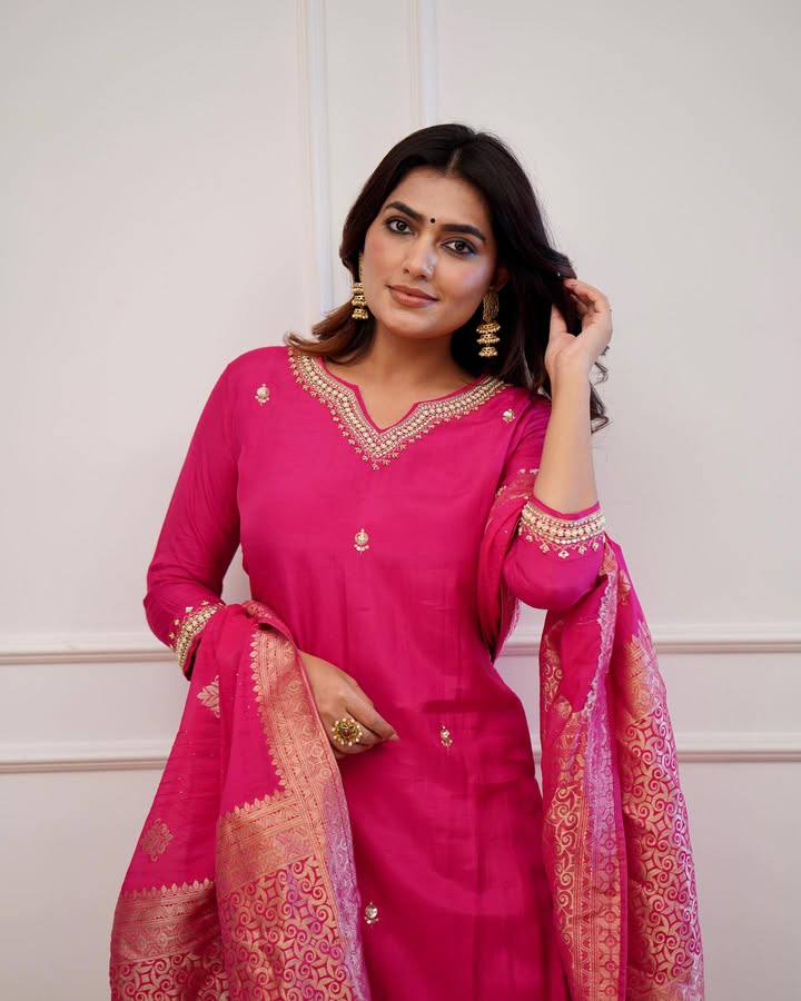 Embrace elegance in this exquisite pink kurti set, featuring intricate embroidery, a luxurious dupatta with gold detailing, and a timeless silhouette