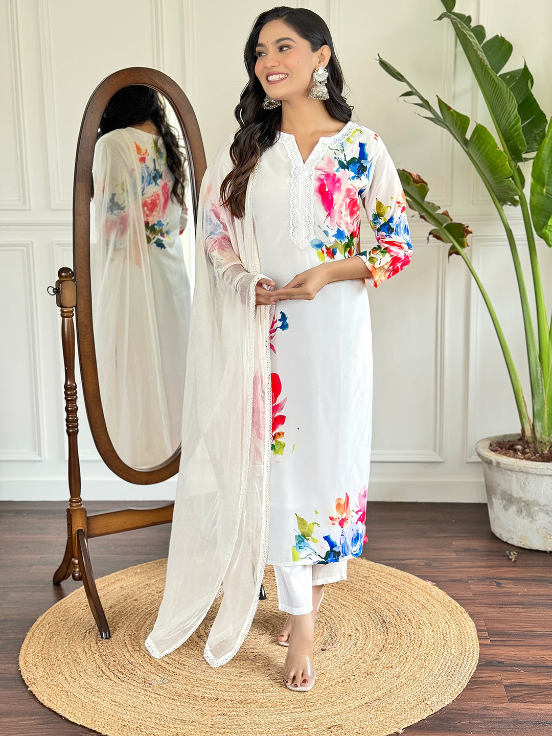 Radiate grace in this stunning white floral Kurti set, adorned with vibrant blossoms and a delicate lace neckline