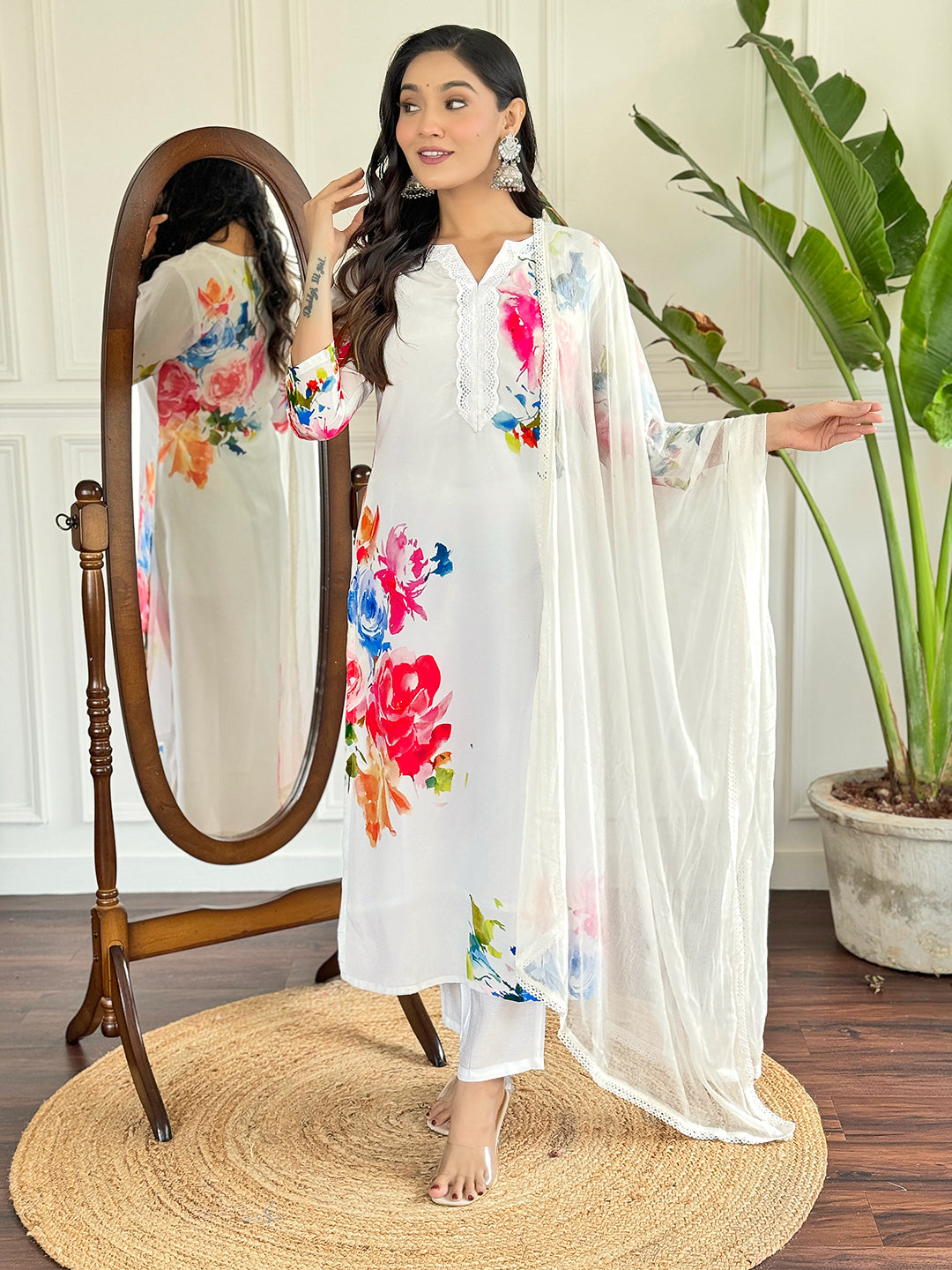 Radiate grace in this stunning white floral Kurti set, adorned with vibrant blossoms and a delicate lace neckline