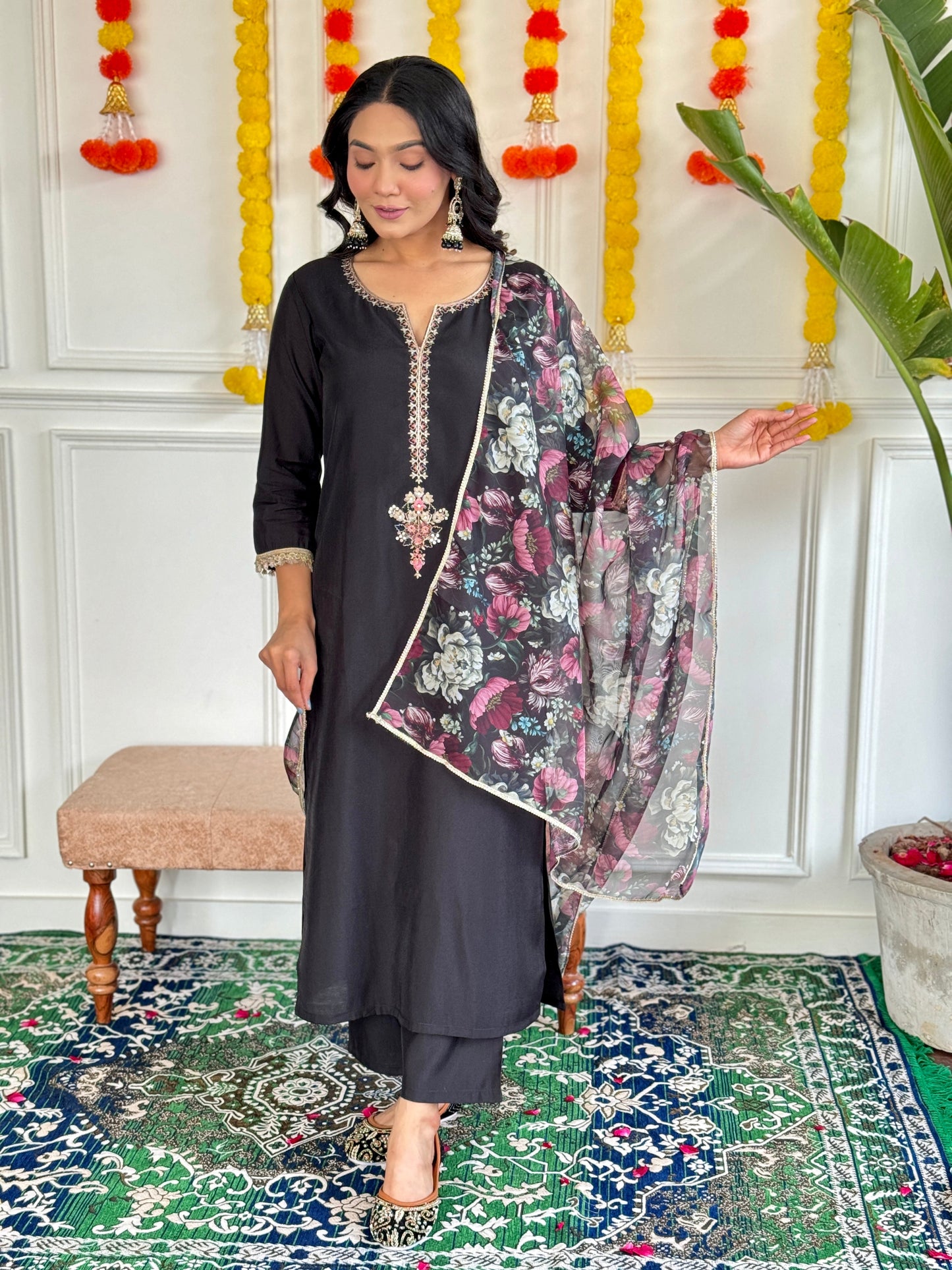 Step into elegance with this stunning black Kurti set, featuring intricate embroidery and a floral chiffon dupatta