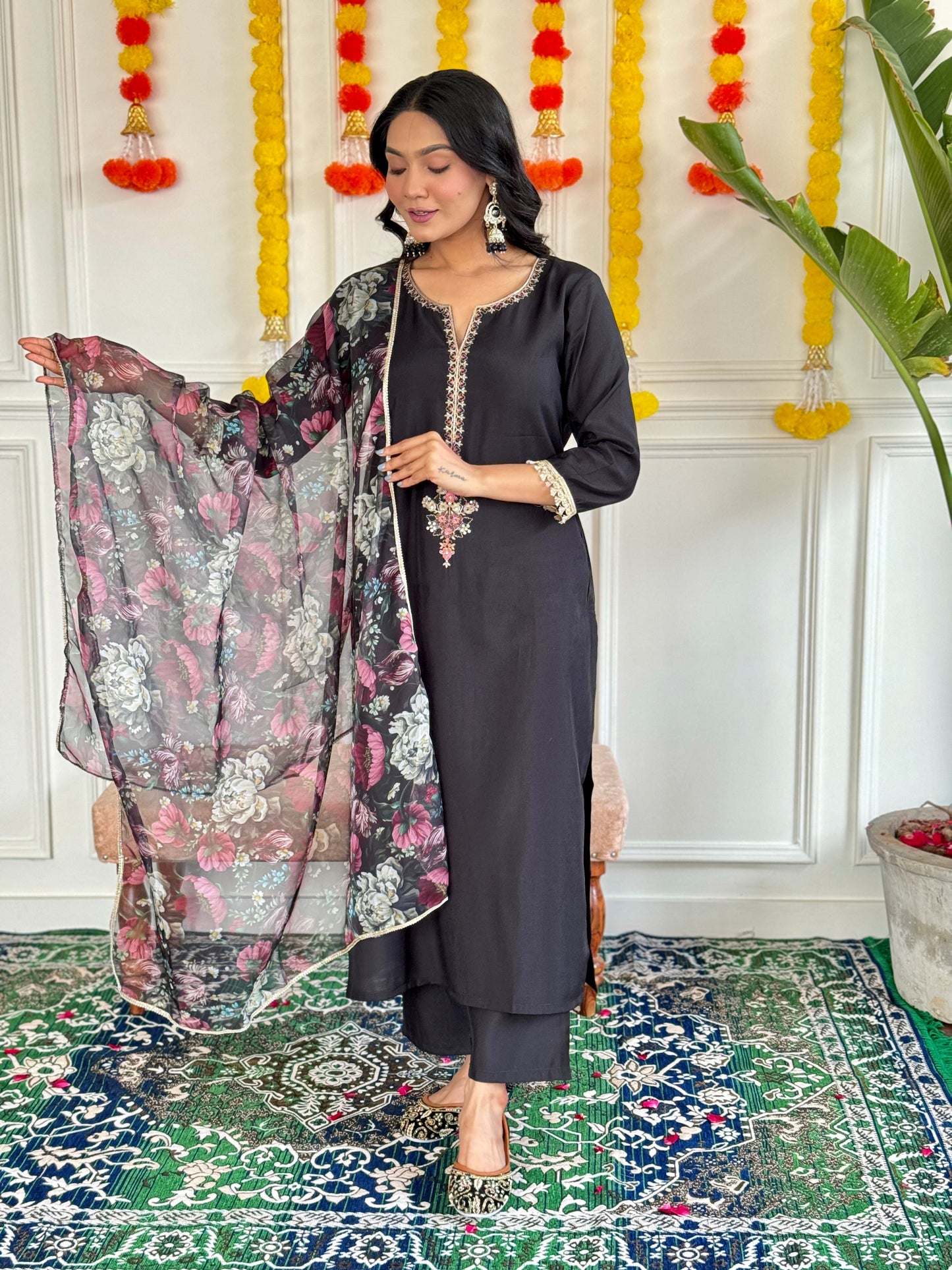 Step into elegance with this stunning black Kurti set, featuring intricate embroidery and a floral chiffon dupatta