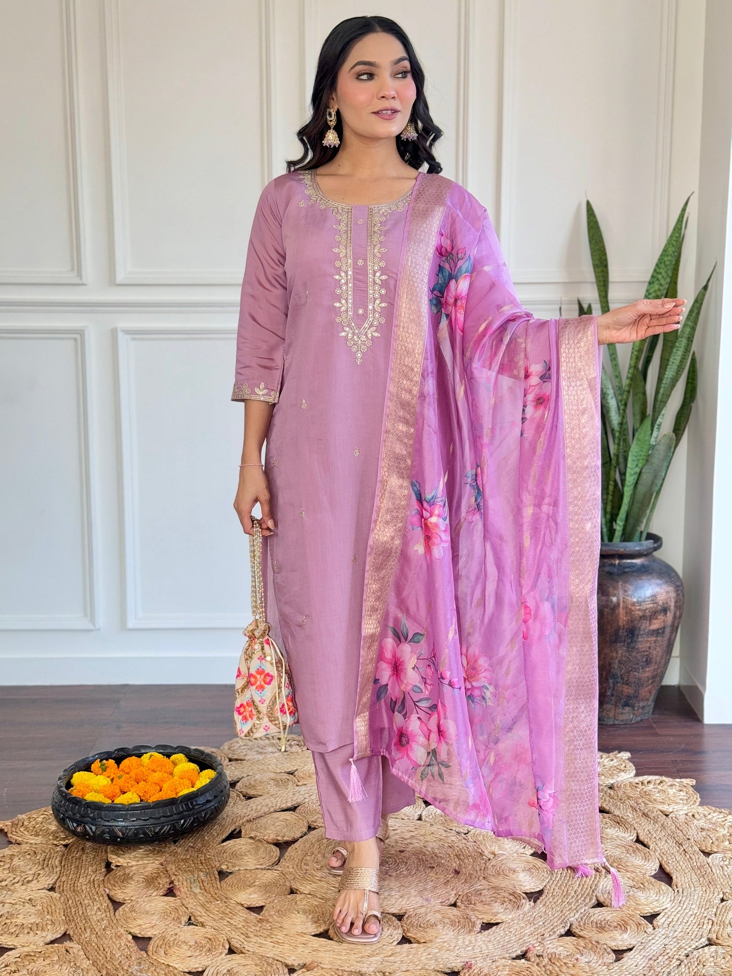 Embrace elegance with this pastel lavender Kurti set, adorned with delicate embroidery and a floral-printed dupatta