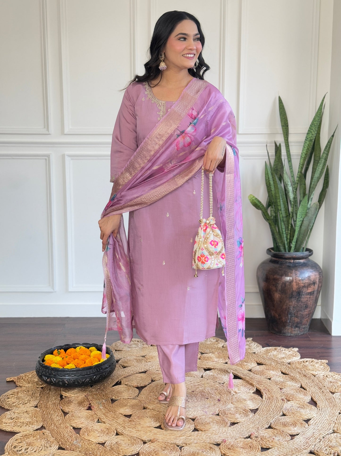 Embrace elegance with this pastel lavender Kurti set, adorned with delicate embroidery and a floral-printed dupatta