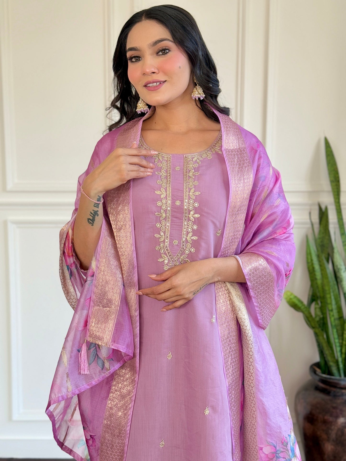 Embrace elegance with this pastel lavender Kurti set, adorned with delicate embroidery and a floral-printed dupatta