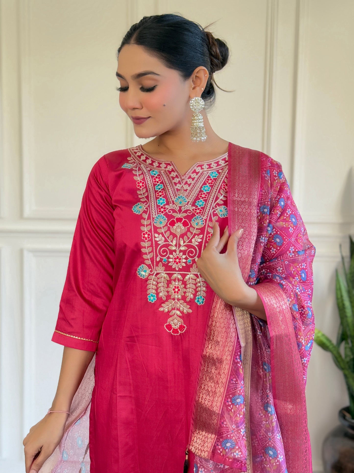 Make a bold statement with this vibrant pink Kurti set, adorned with intricate embroidery and a beautifully detailed dupatta