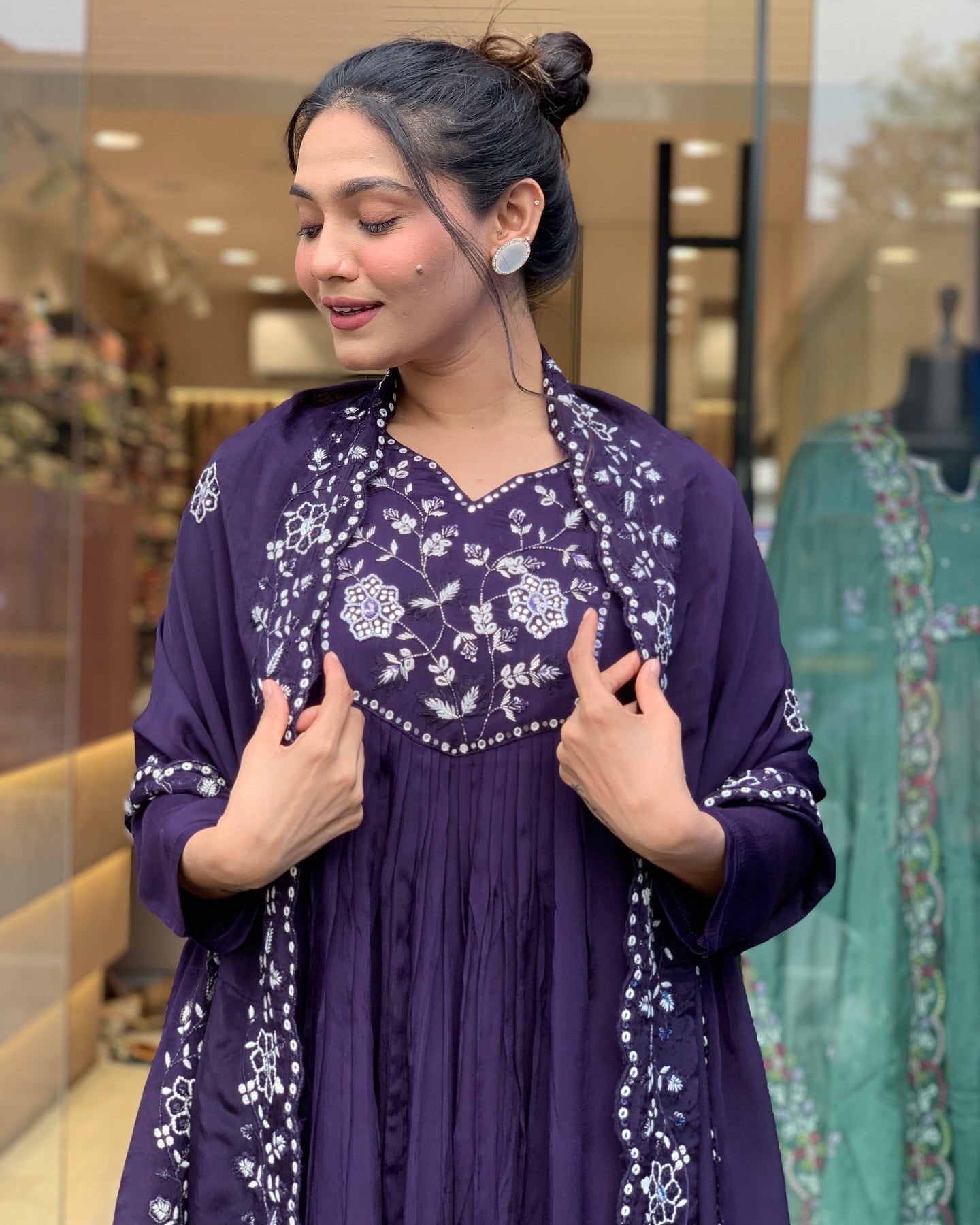 Step into elegance with this deep purple Kurti set, featuring intricate white embroidery and a gracefully flowing silhouette