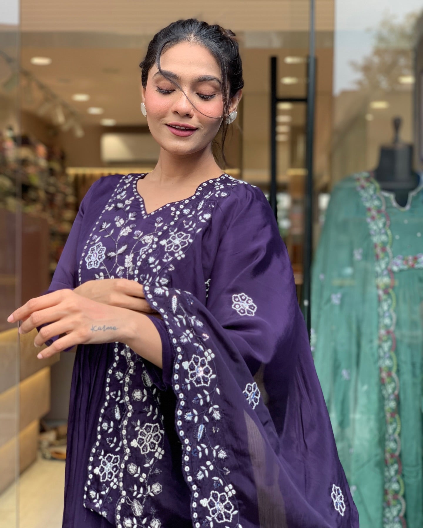 Step into elegance with this deep purple Kurti set, featuring intricate white embroidery and a gracefully flowing silhouette