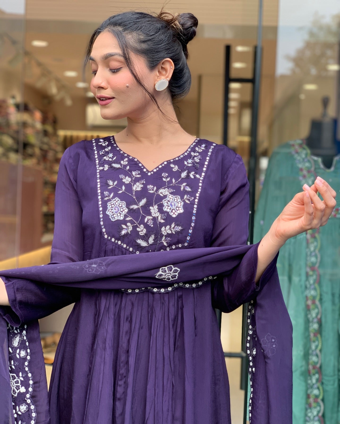 Step into elegance with this deep purple Kurti set, featuring intricate white embroidery and a gracefully flowing silhouette