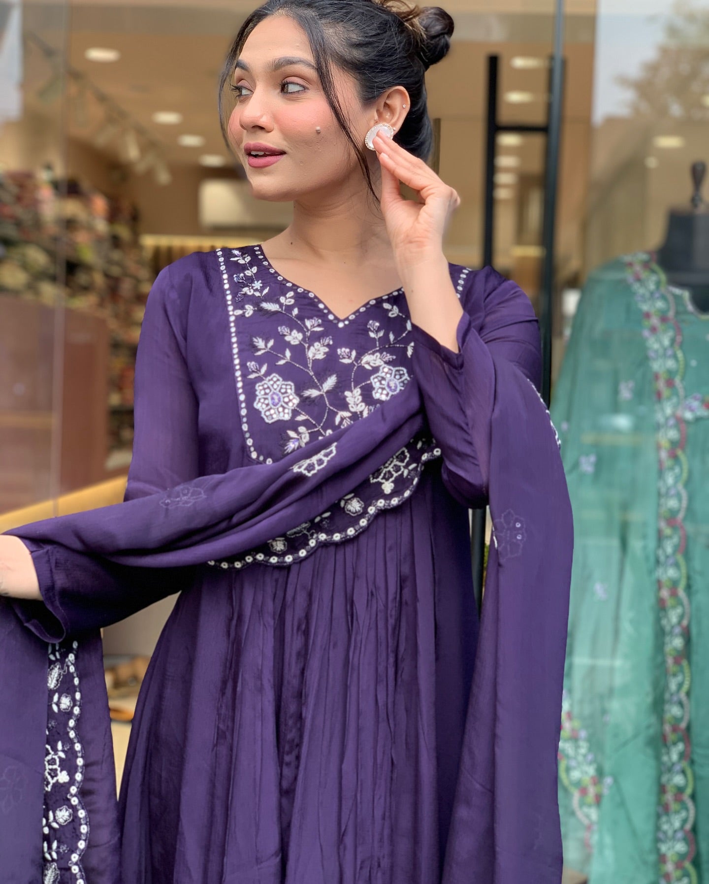 Step into elegance with this deep purple Kurti set, featuring intricate white embroidery and a gracefully flowing silhouette