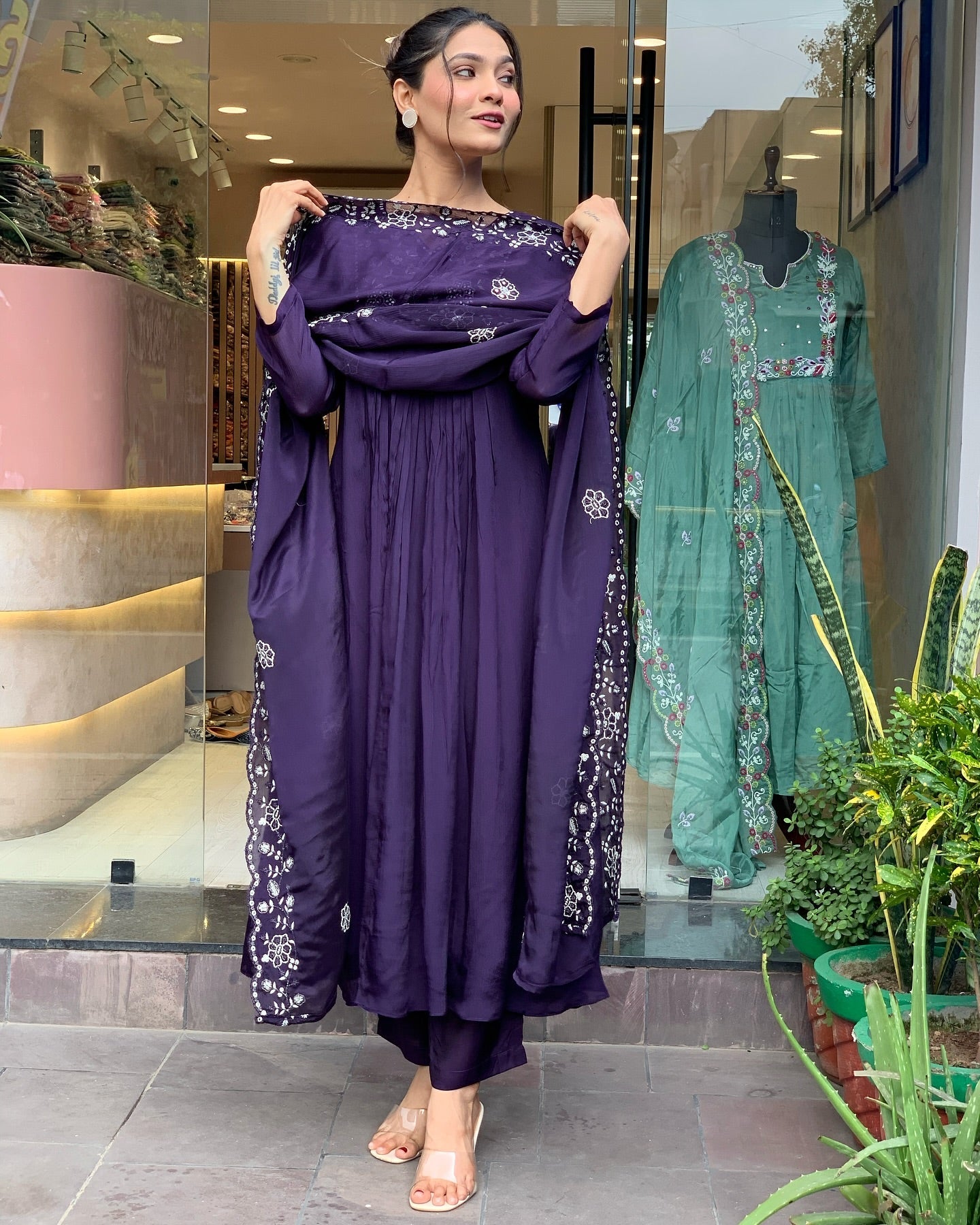 Step into elegance with this deep purple Kurti set, featuring intricate white embroidery and a gracefully flowing silhouette