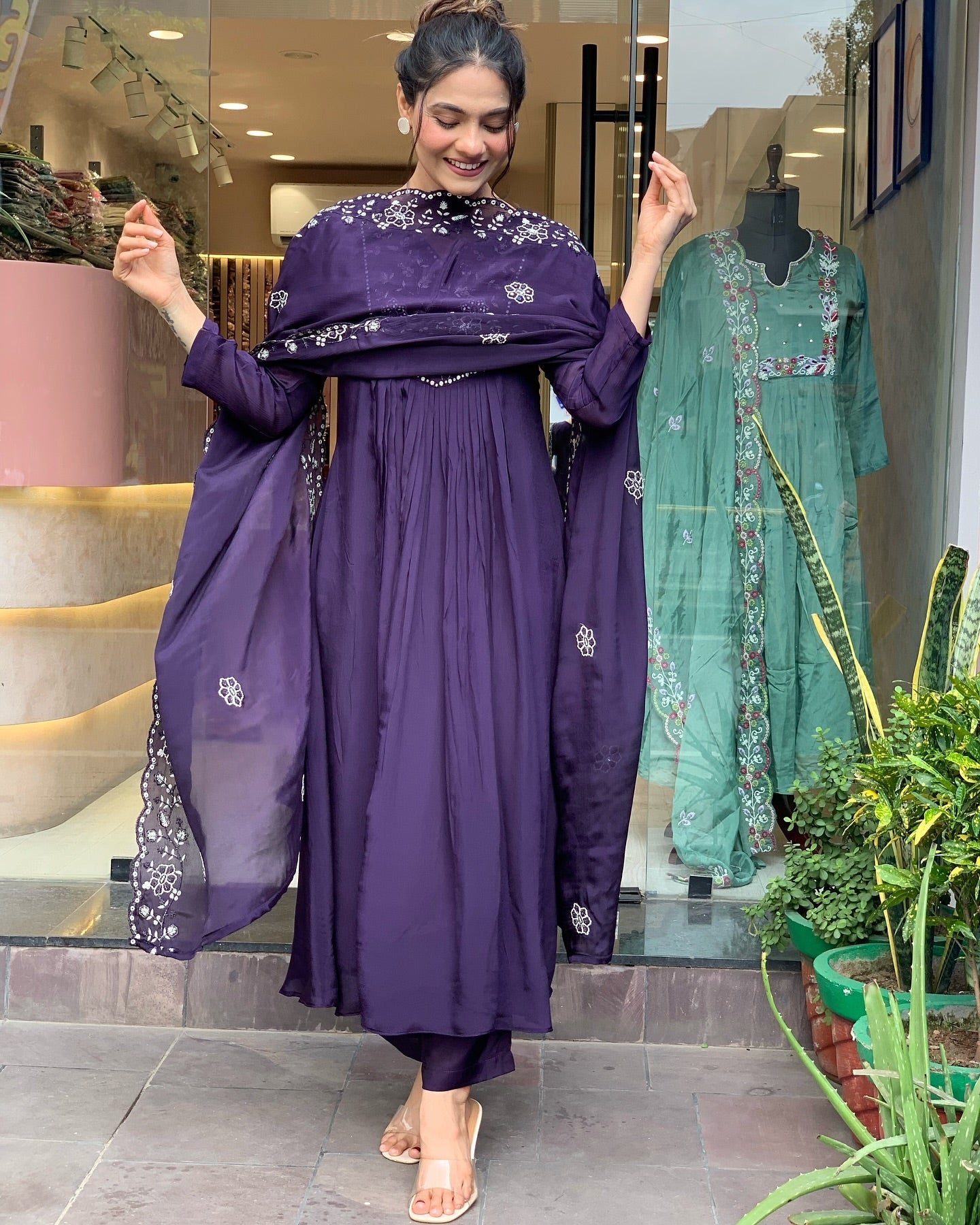 Step into elegance with this deep purple Kurti set, featuring intricate white embroidery and a gracefully flowing silhouette