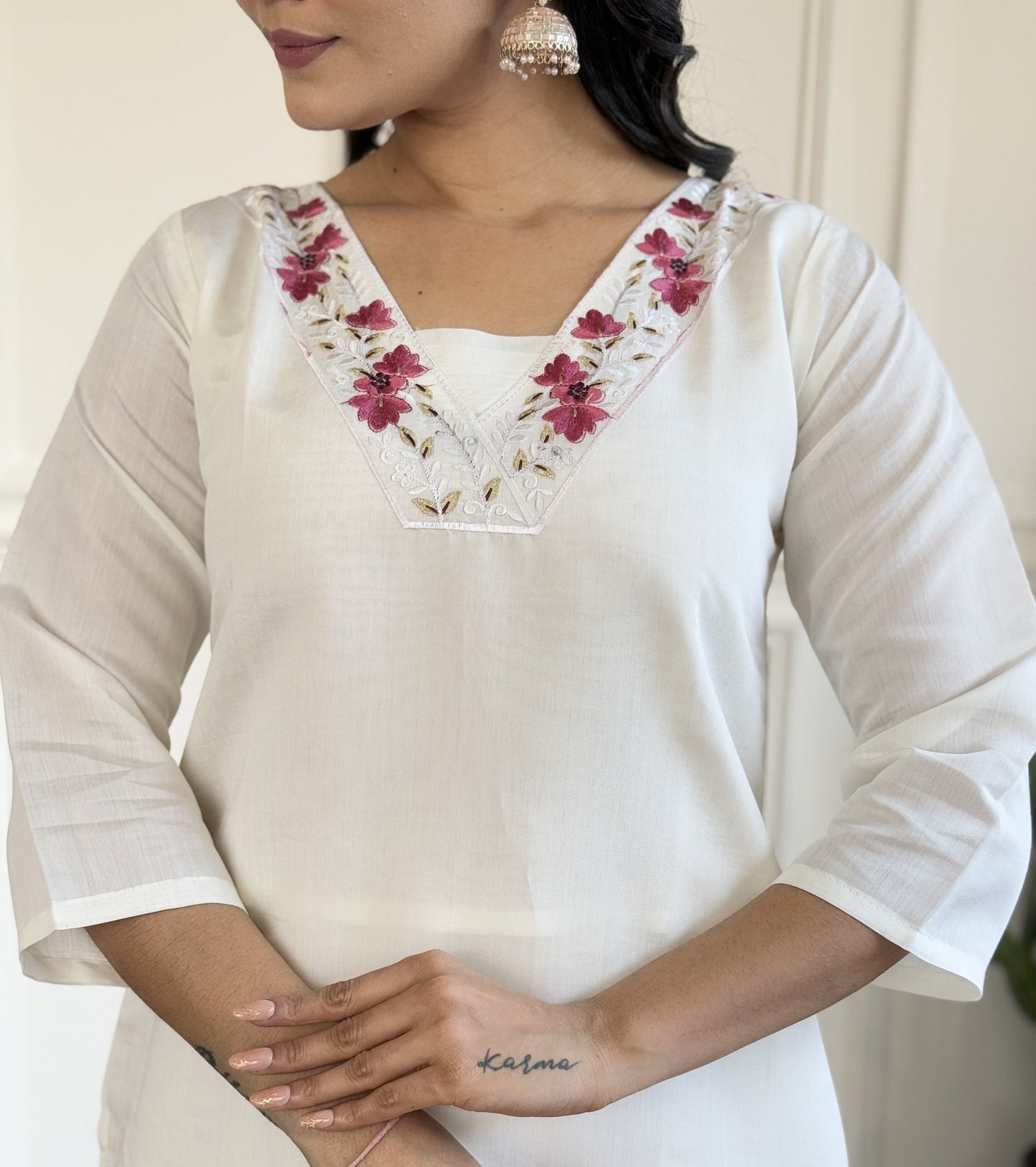 Grace meets elegance in this stunning white Kurti set, adorned with delicate floral embroidery and a soft pink ombre dupatta