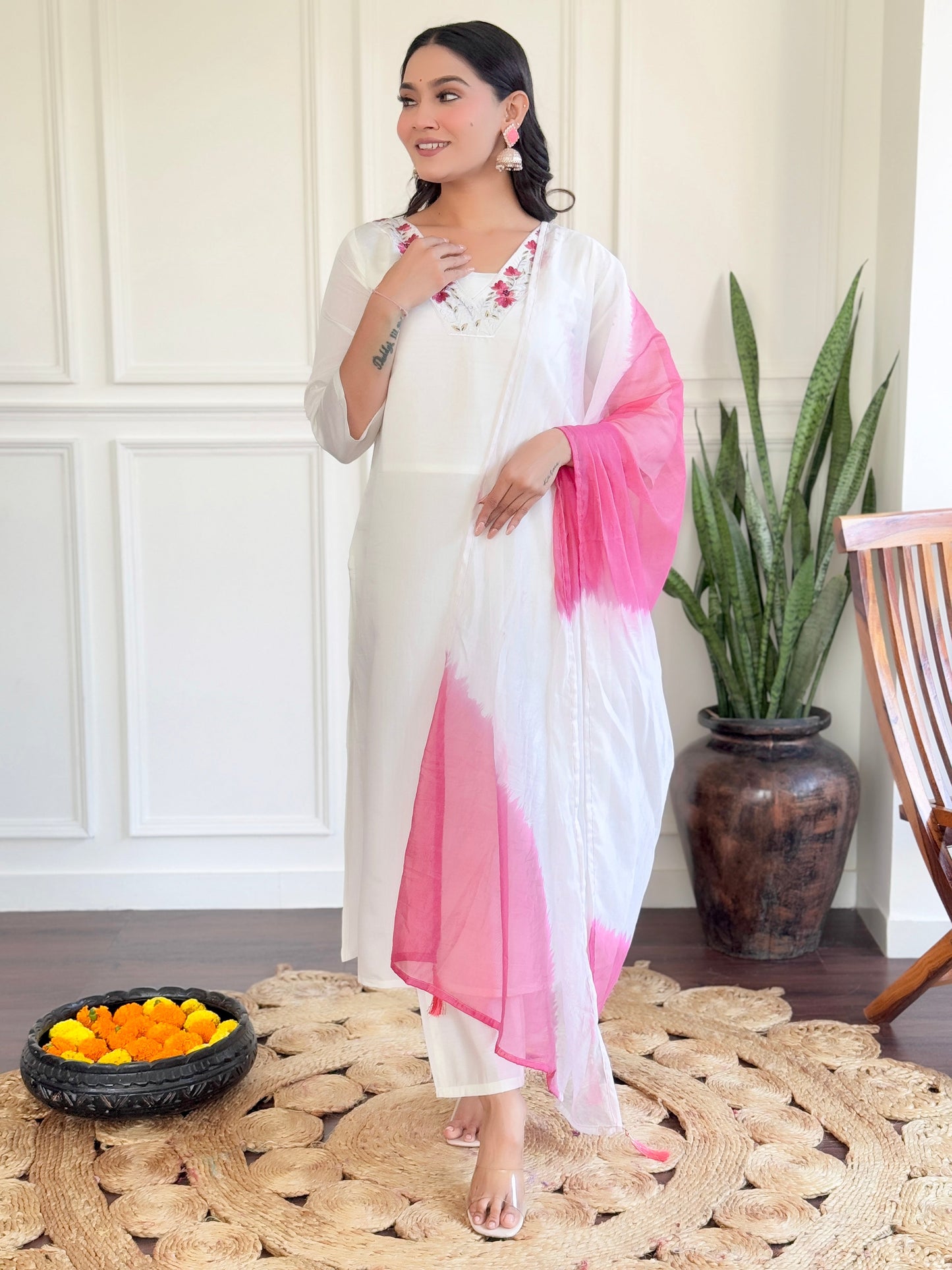 Grace meets elegance in this stunning white Kurti set, adorned with delicate floral embroidery and a soft pink ombre dupatta