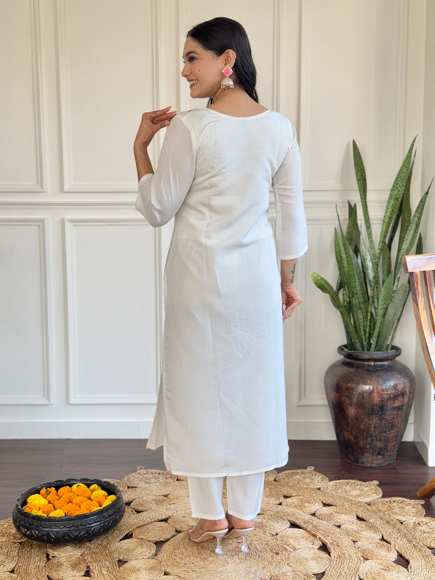 Grace meets elegance in this stunning white Kurti set, adorned with delicate floral embroidery and a soft pink ombre dupatta