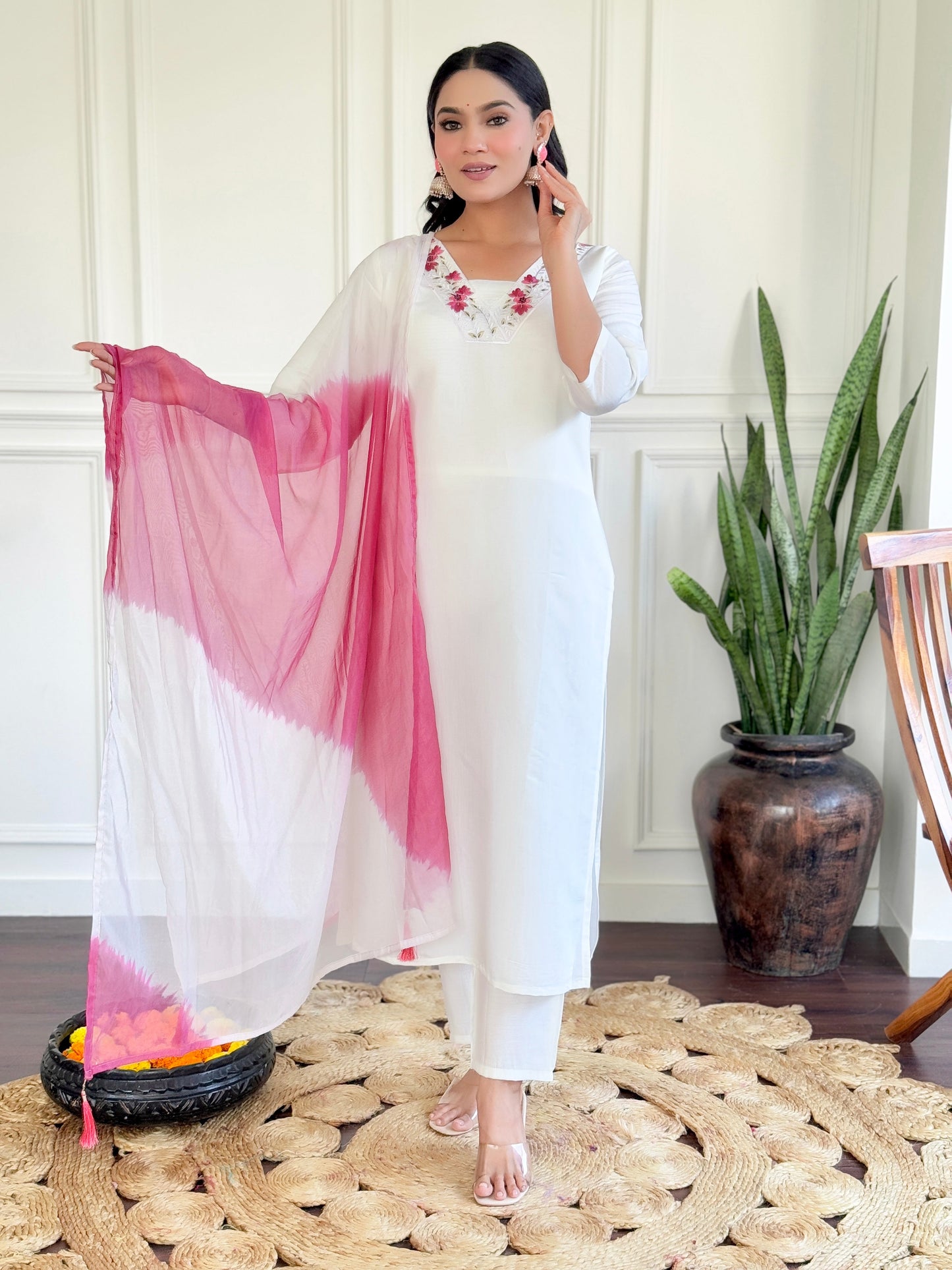 Grace meets elegance in this stunning white Kurti set, adorned with delicate floral embroidery and a soft pink ombre dupatta