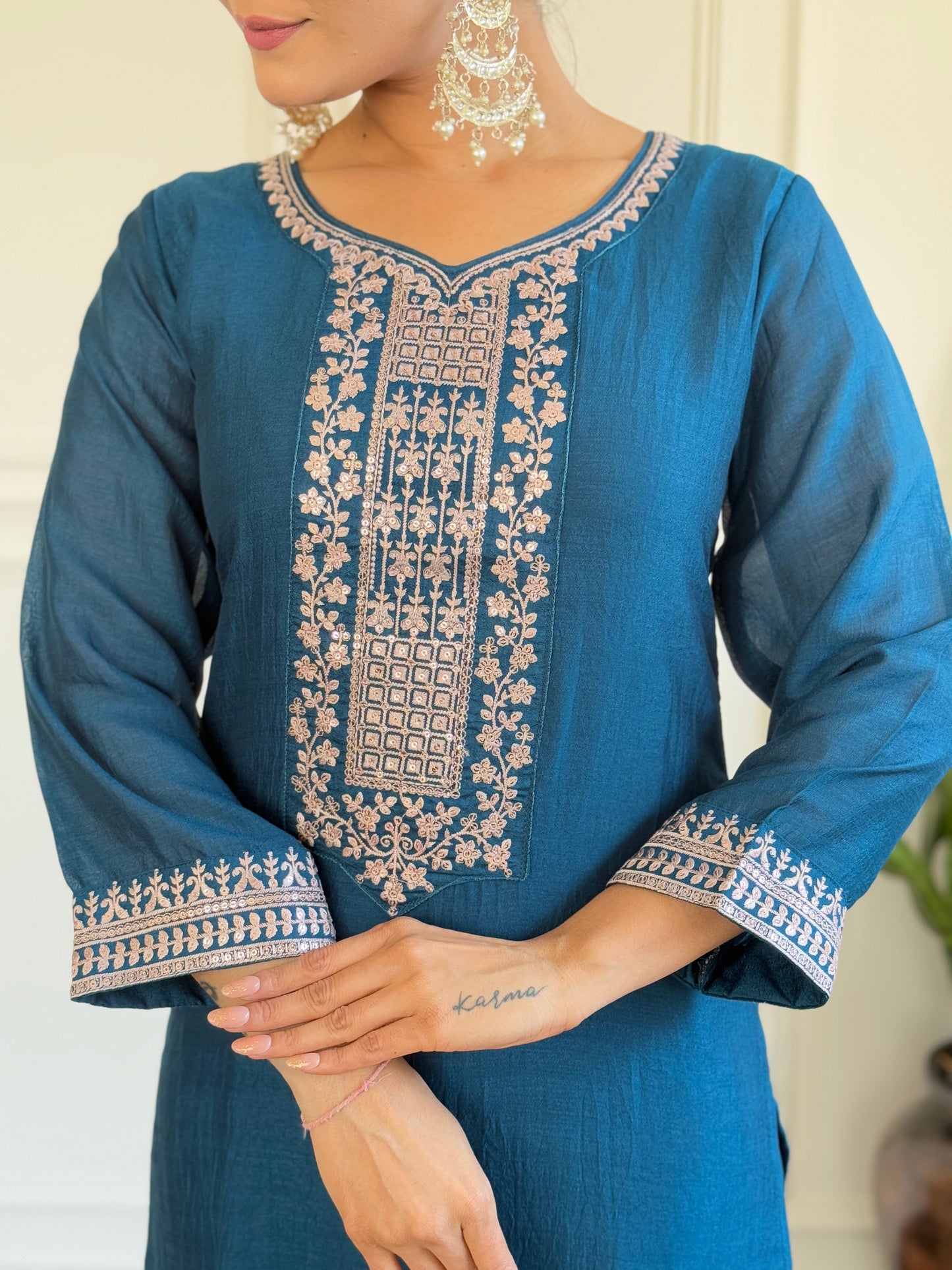 Step into elegance with this deep blue Kurti set, featuring exquisite embroidery and a delicately adorned dupatta