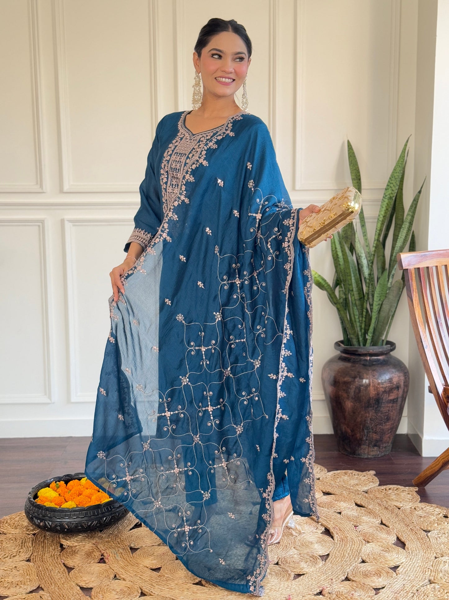 Step into elegance with this deep blue Kurti set, featuring exquisite embroidery and a delicately adorned dupatta