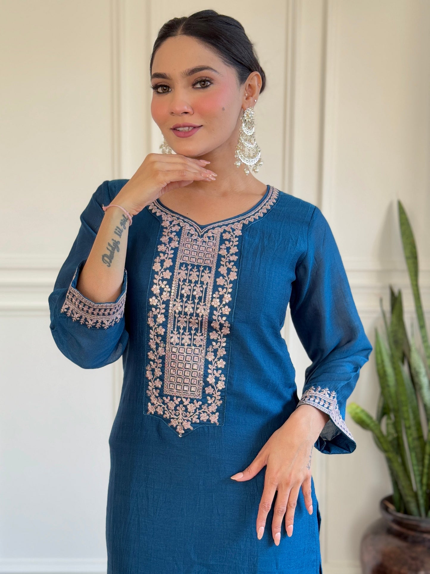 Step into elegance with this deep blue Kurti set, featuring exquisite embroidery and a delicately adorned dupatta