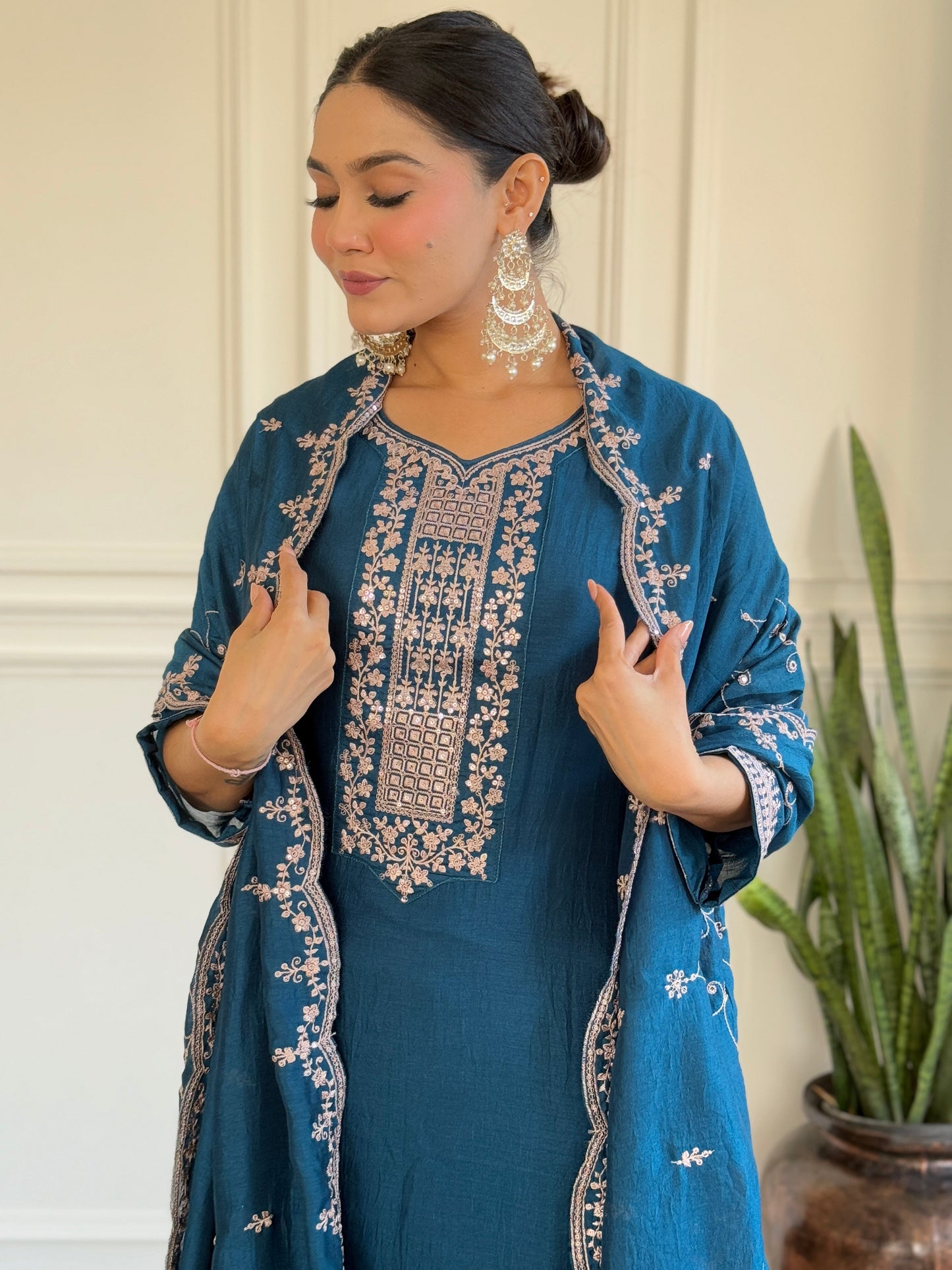 Step into elegance with this deep blue Kurti set, featuring exquisite embroidery and a delicately adorned dupatta